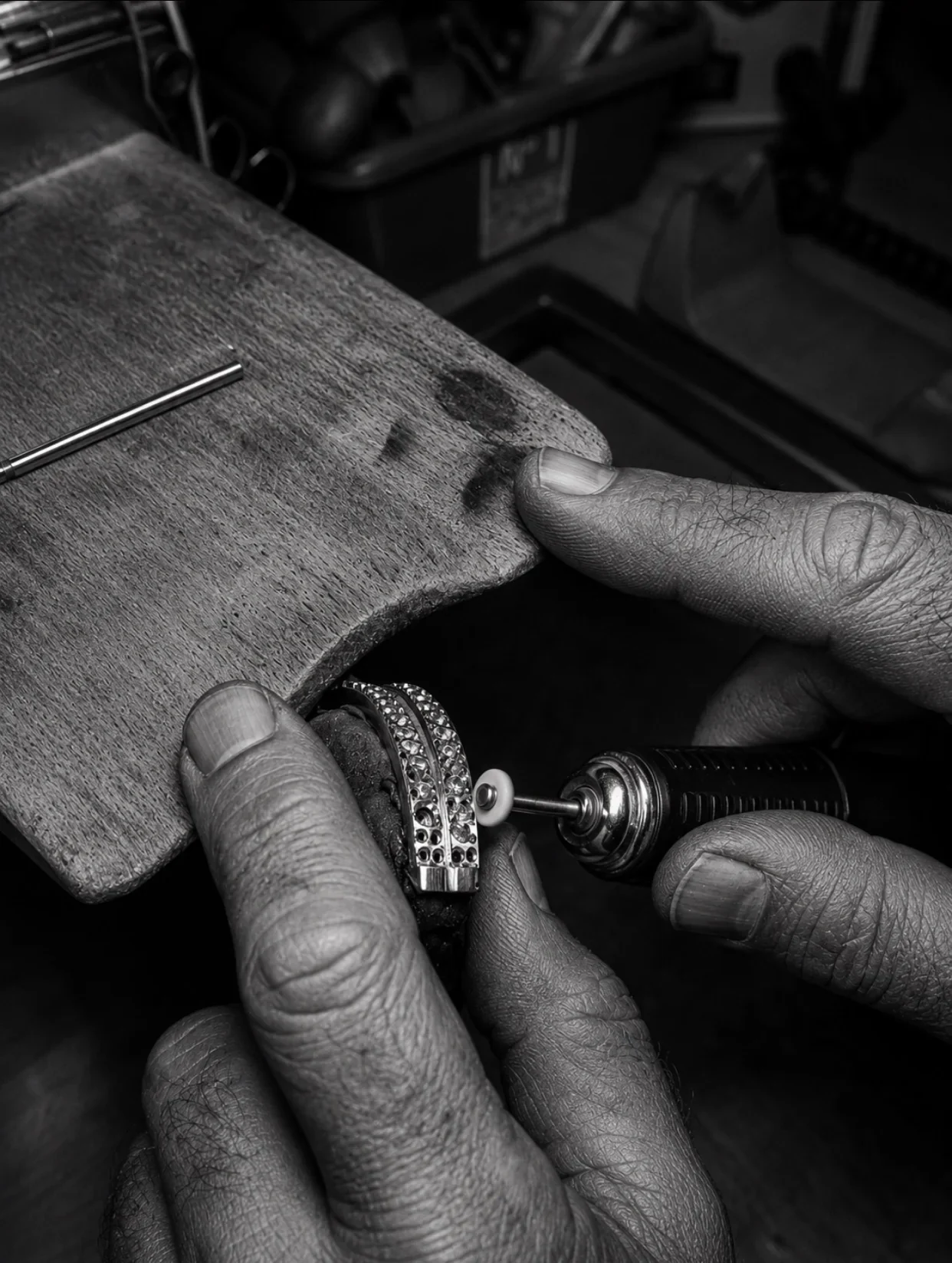 KELARE High Jewelry artisan polishing a bracelet at the jeweler’s bench