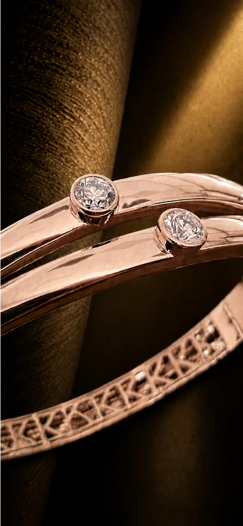 Close-up of PURE in rose gold showing the two principal diamonds and internal K frieze